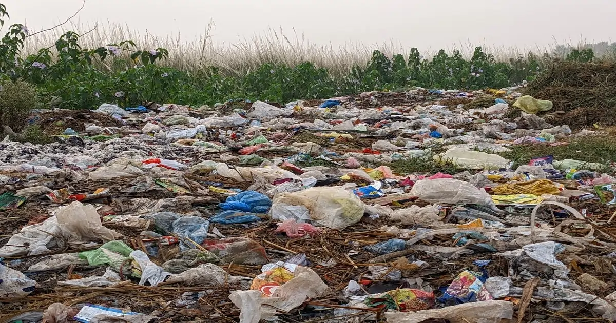 Open dumping of plastic and solid waste on land, a common cause of land pollution and soil contamination