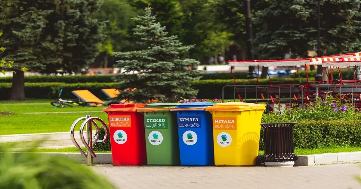 Color-coded recycling bins for waste segregation, showing a practical way to control environmental pollution.