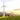 A wind turbine near a house in a serene natural setting, symbolizing environmental preservation efforts.