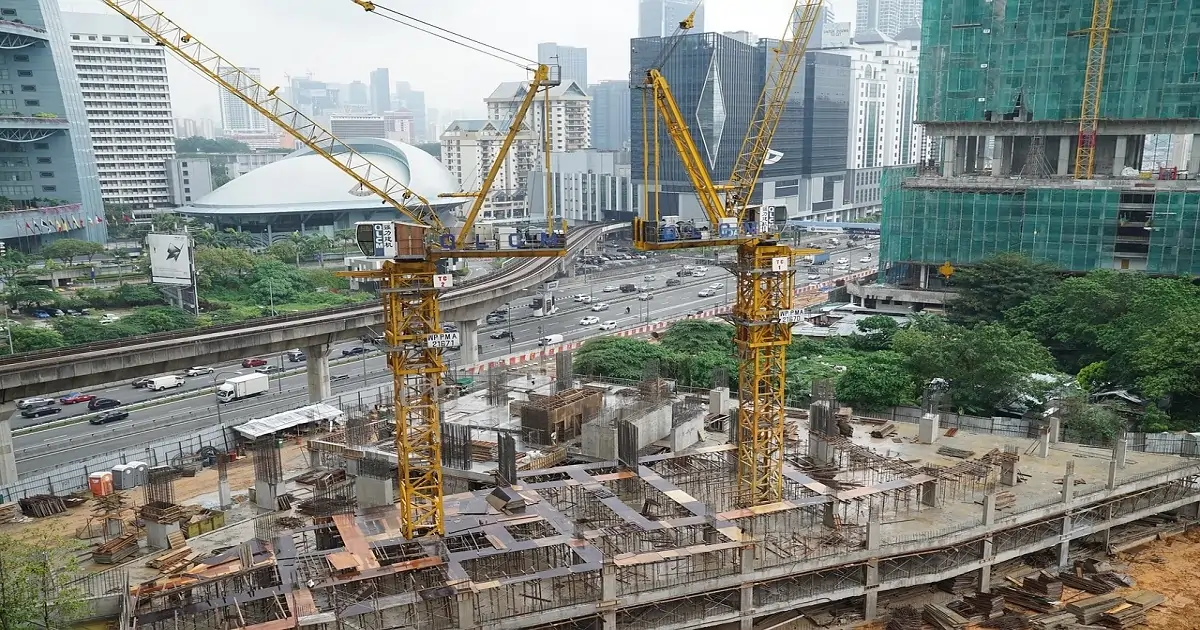 Urban construction site with cranes and machinery creating human-made noise pollution