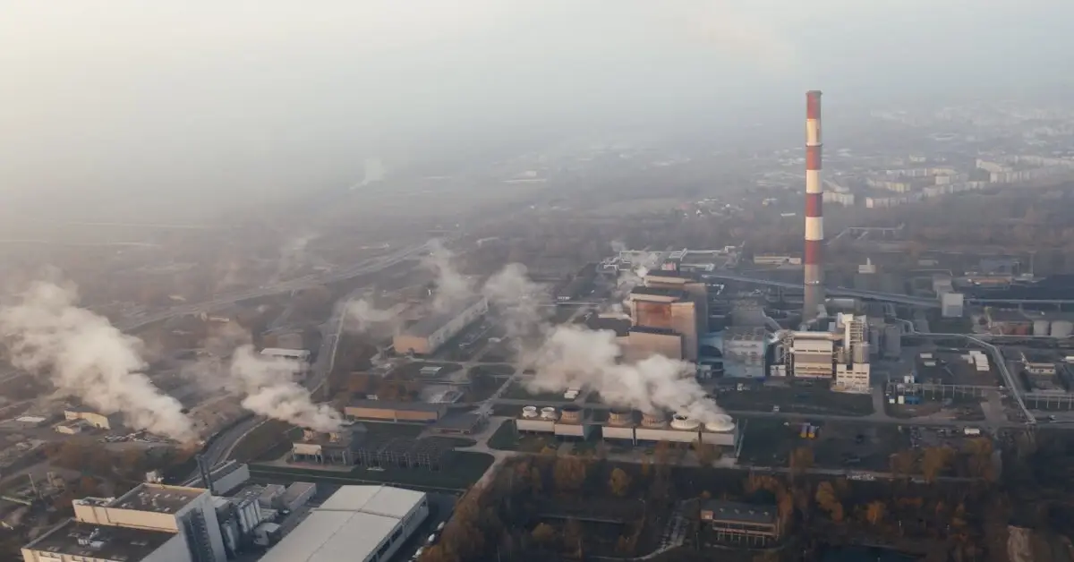 Factory chimney releasing smoke, representing air pollution as a major global environmental issue caused by industrial emissions.